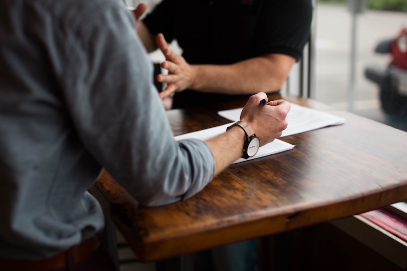 Two Men Having A Planning Meeting Insight Quality Services