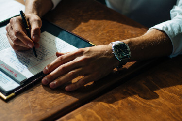 Man taking notes on notepad