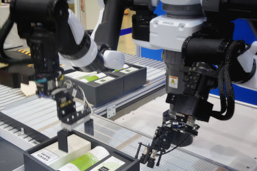 Robot arms assembling a package