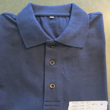 Blue polo shirt ready for garment inspection procedures
