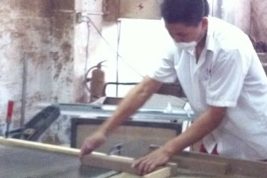 Factory worker working with wood