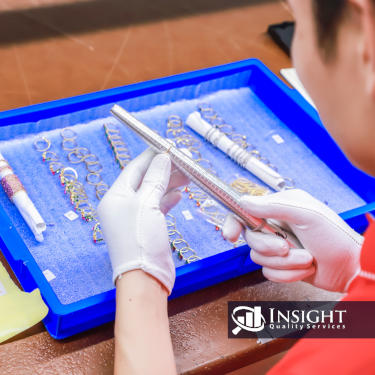 Insight Quality Services inspector examining jewelry