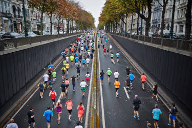 People running on a city street during a marathon