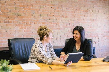 Two businesswomen having a discussion