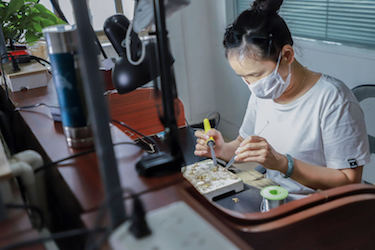 Woman soldering