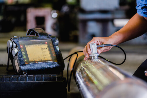 Ultrasonic test being performed on incoming materials
