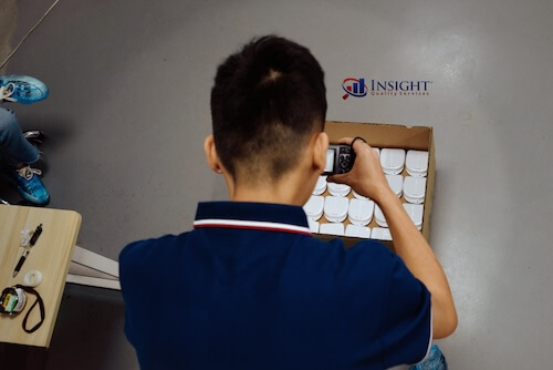 Product inspector photographing product