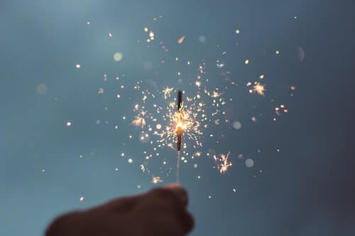 Hand holding a sparkler