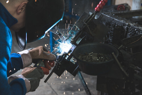 Man in Turkey welding metal parts