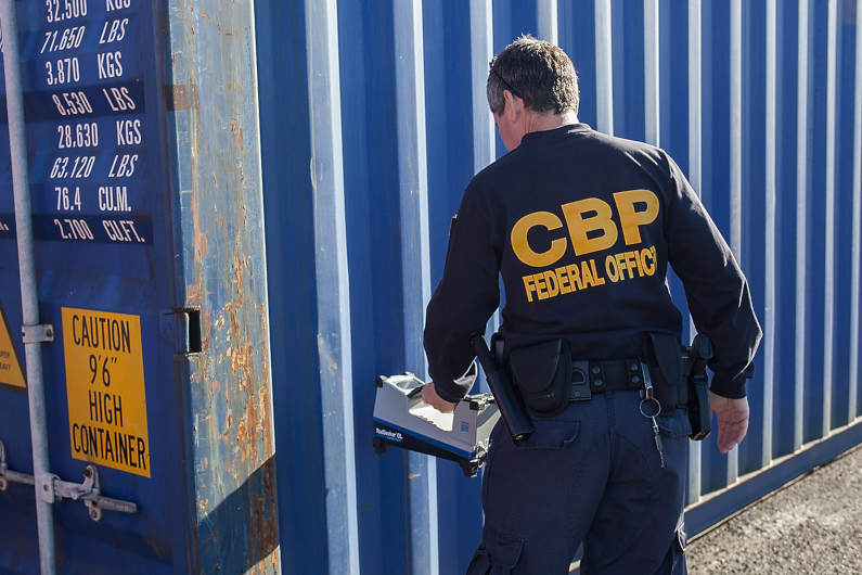 CBP officer inspecting container