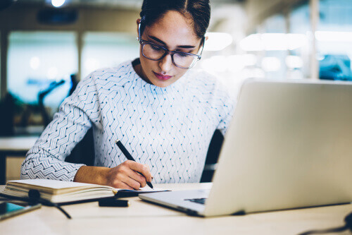 Female manager writing plan