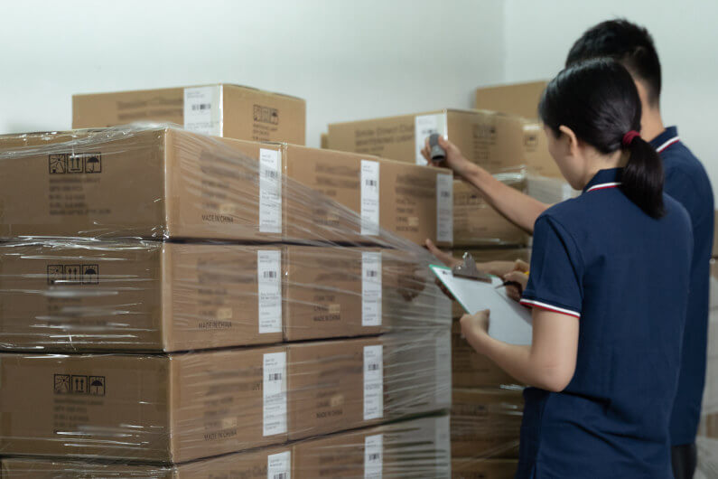 Inspectors selecting cartons for third-party inspection