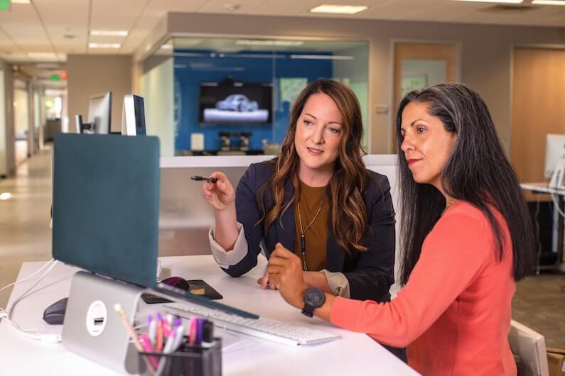 Women discussing something in an office