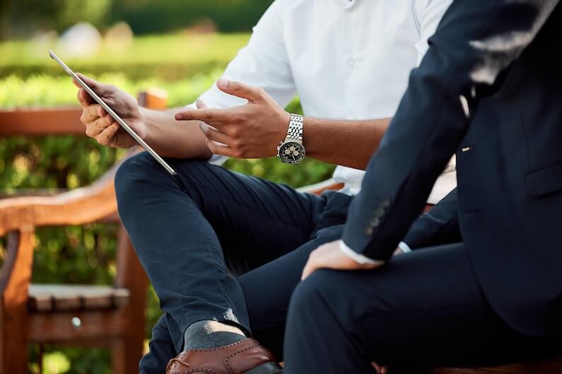 Two people happily discussing business