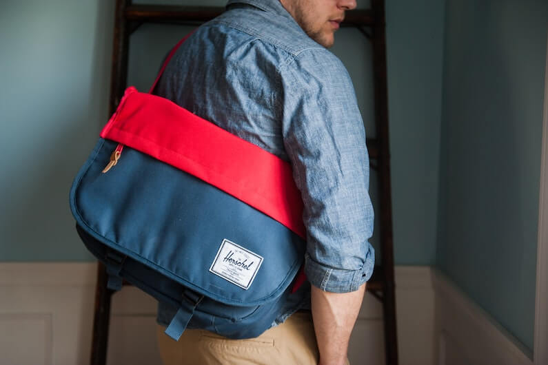 Man wearing cross-body messenger bag