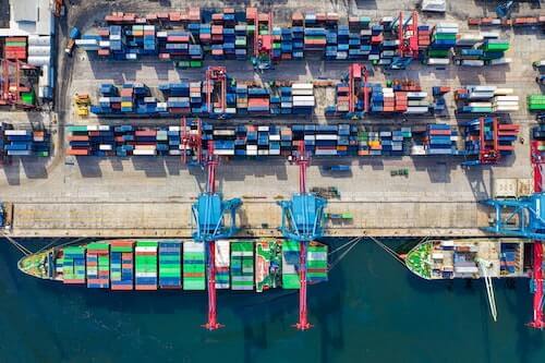 Cargo ship docked at container port