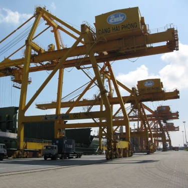 Shipping container atop crane