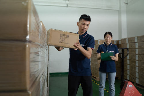 Inspectors pulling cartons for a pre-shipment inspection