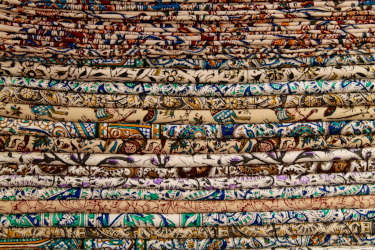 Various Middle Eastern fabrics stacked on top of eachother