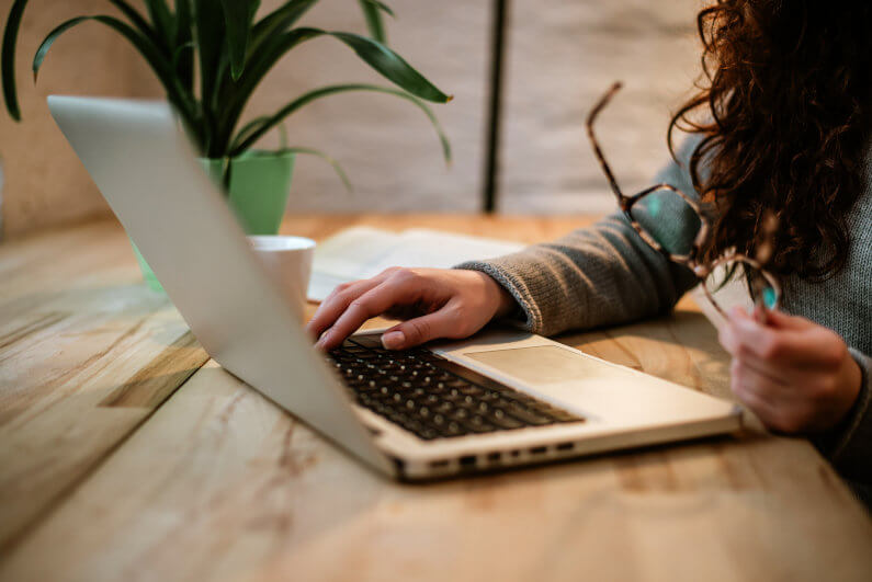 Woman typing on laptop