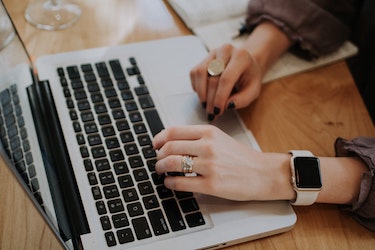 Woman typing on laptop