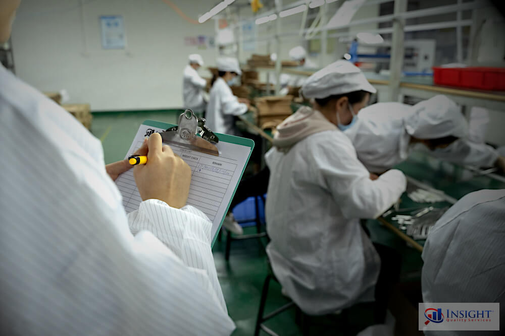Insight auditor observing a production line