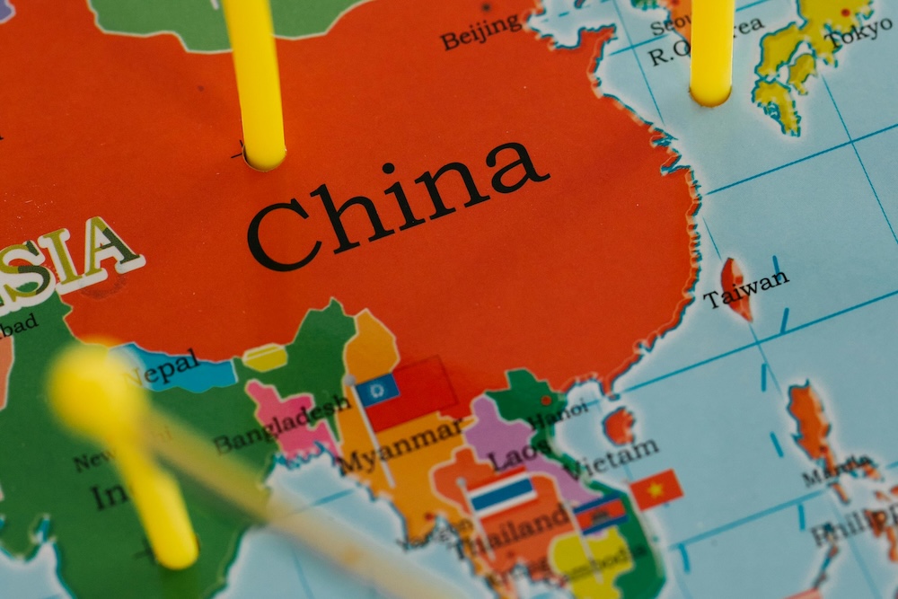 Map of Asia with flags planted