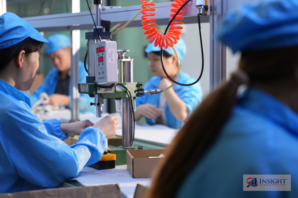 Workers on production line in an electronics factory
